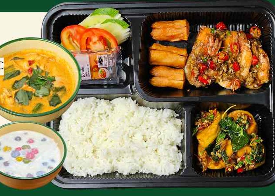 A Chon Kaeng Noble Set lunch box — two main dishes, a curry, dessert and a herbal drink.
